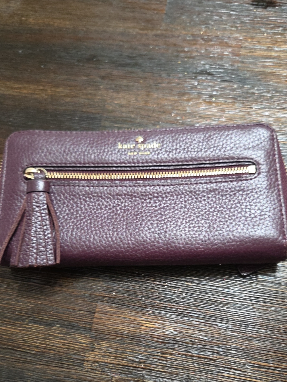 kate spade plum pebbled leather zip-around wallet with tassel